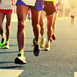 Marathon running race, people feet on city road